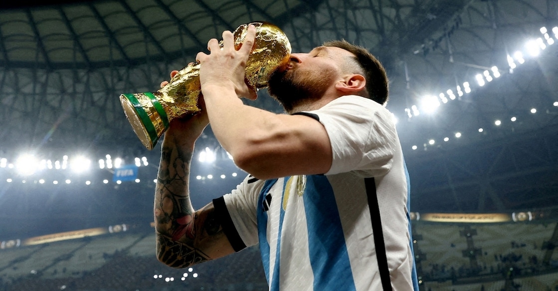 Lionel Messi kissing the World Cup trophy after winning the final in 2022 against France. Photo: Reuters