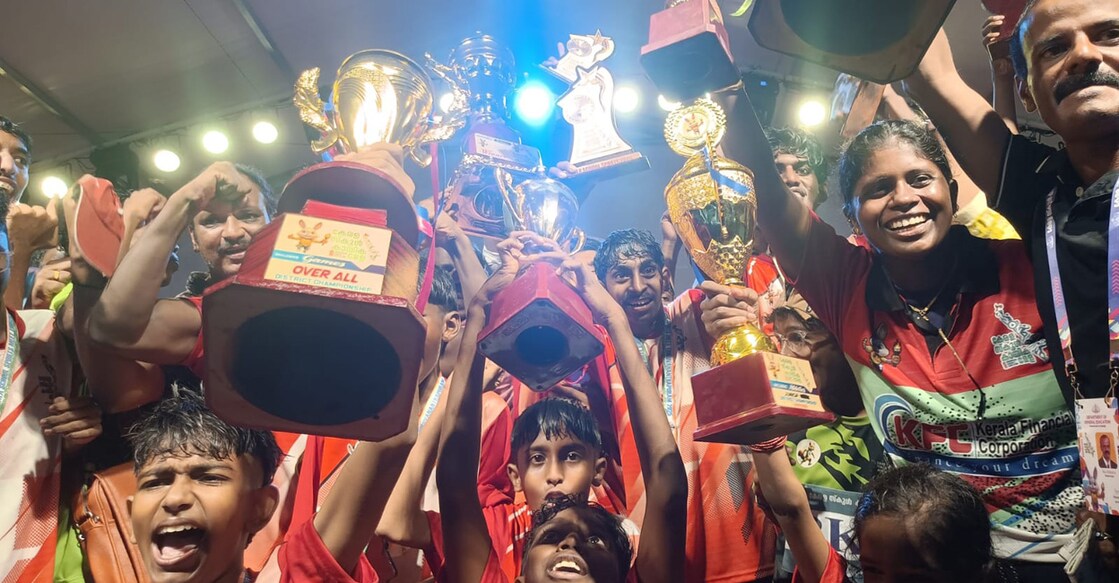 Athletes of Palakkad celebrate with trophies after securing the overall title of the one-day Inclusive Sports as part of the Kerala State School Sports & Games at the Chandrasekharan Nair Stadium in Thiruvananthapuram on October 22, 2025. Photo: PRD
