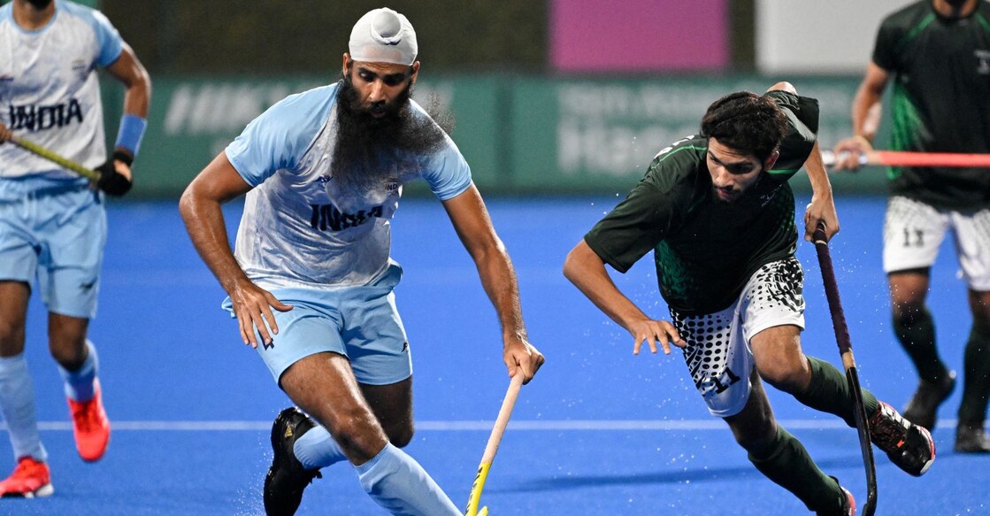 A representational image of Indian and Pakistani hockey players. Photo: AFP