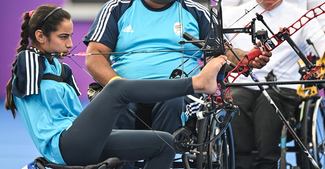 India's Devi Sheetal competes in the mixed team compound - open gold medal archery match during the 2022 Asian Para Games in Hangzhou, in China's eastern Zhejiang province on October 26, 2023. File photo: AFP/ Hector Retamal