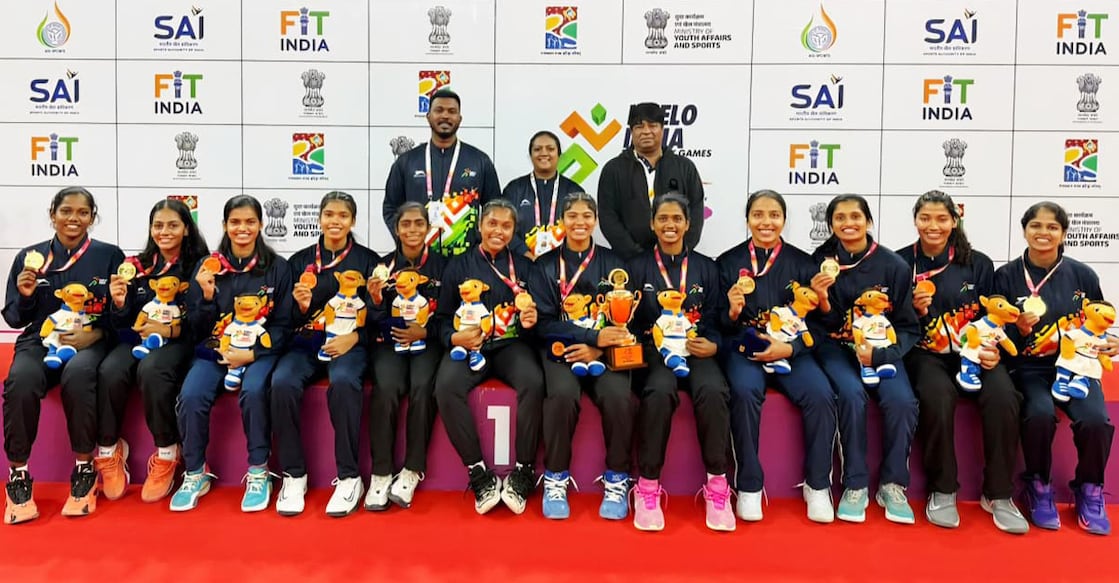 Players and coaches of MG University, Kottayam pose after winning gold in women’s basketball at the Khelo India University Games in Rajasthan on December 5, 2025. Photo: Special arrangement