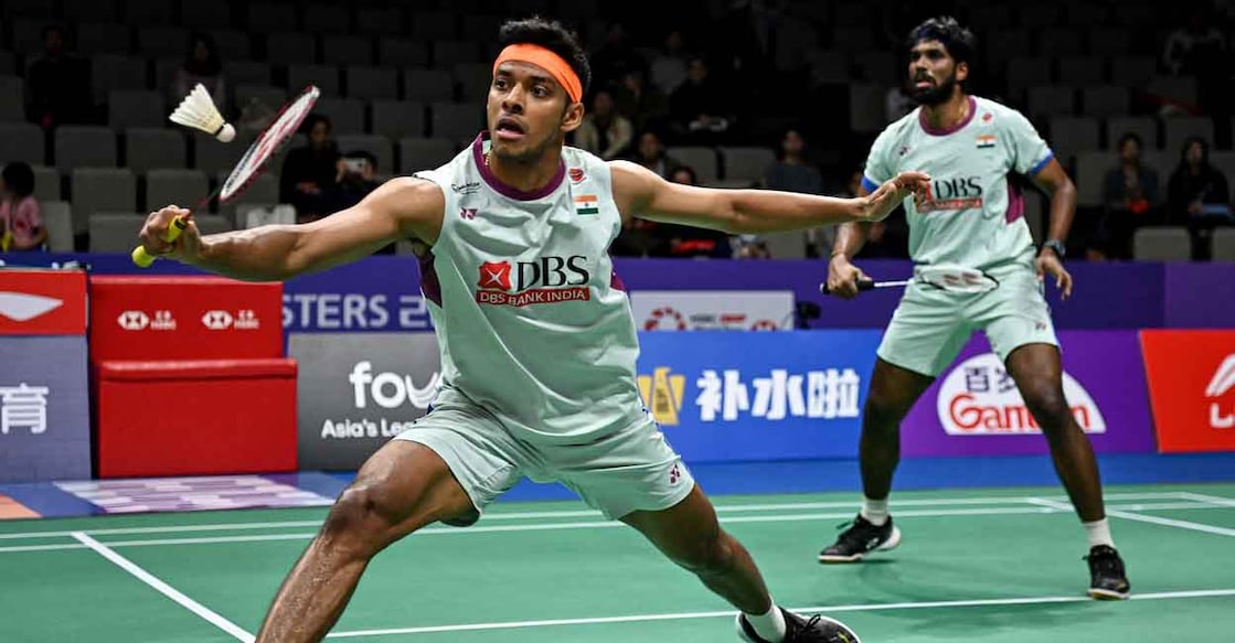 BADMINTON-CHN India's Chirag Shetty (L) and Satwiksairaj Rankireddy play against Denmark's Kim Astrup and Anders Skaarup Rasmussen during the men's doubles quarterfinal match of the BWF World Tour China Masters 2024 badminton tournament in Shenzhen, in southern China's Guangdong province on November 22, 2024. (Photo by AFP) / China OUT / CHINA OUT