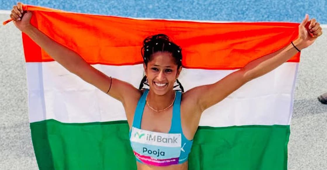 Pooja poses with the tri-colour after clinching gold in Asian Athletics Championship high jump in Gumi, South Korea on May 30, 2025. Photo courtesy: Pooja's instagram account