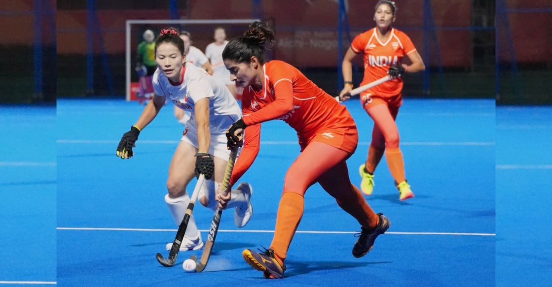 India's Shilpi Dabas, right, competes for the ball with China's Zhong Jiaqi, left, during the women's hockey gold medal match at the Asian Games in Gifu, Japan, on Friday. Photo: PTI. 
