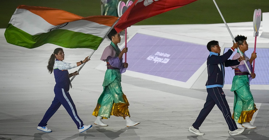 Nagoya: India’s flag bearer Neeru Dhanda and others during the closing ceremony, marking the conclusion of the 20th Asian Games, in Nagoya, Japan, Sunday, Oct. 4, 2026. (PTI Photo/Arun Sharma)(PTI10_04_2026_000178A)