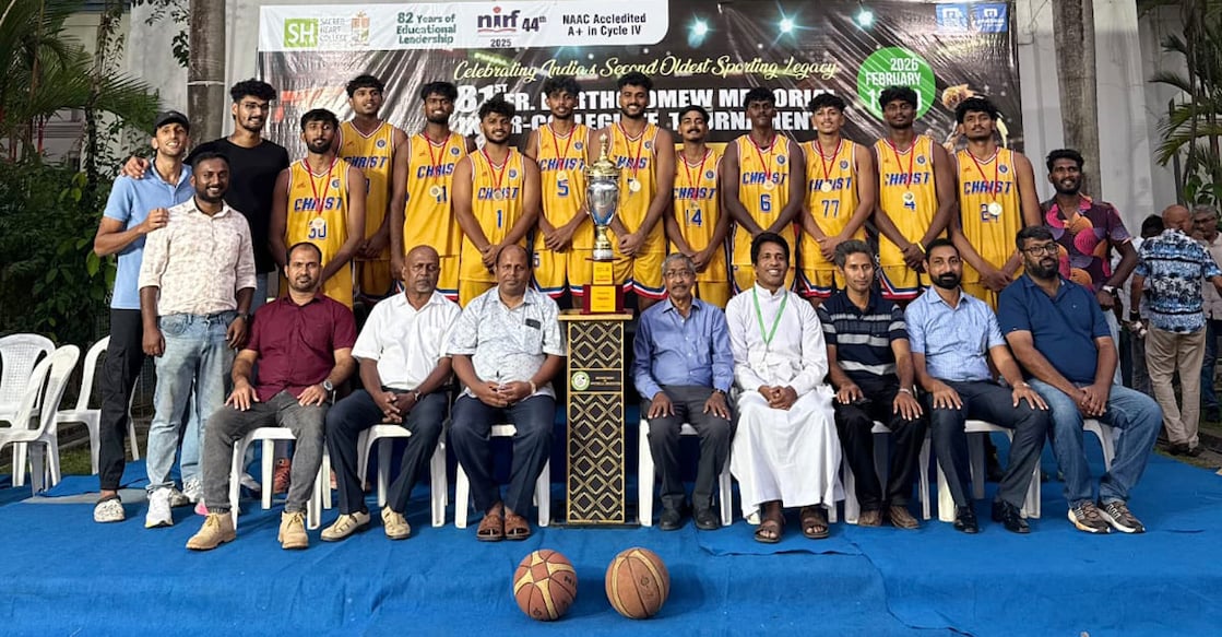 Players and staff of Christ College, Irinjalakuda pose with officials and organisers after winning the Fr Bartholomew Memorial Inter-Collegiate Basketball Tournament in Thevara, Kochi on February 17, 2026. Photo: Special arrangement