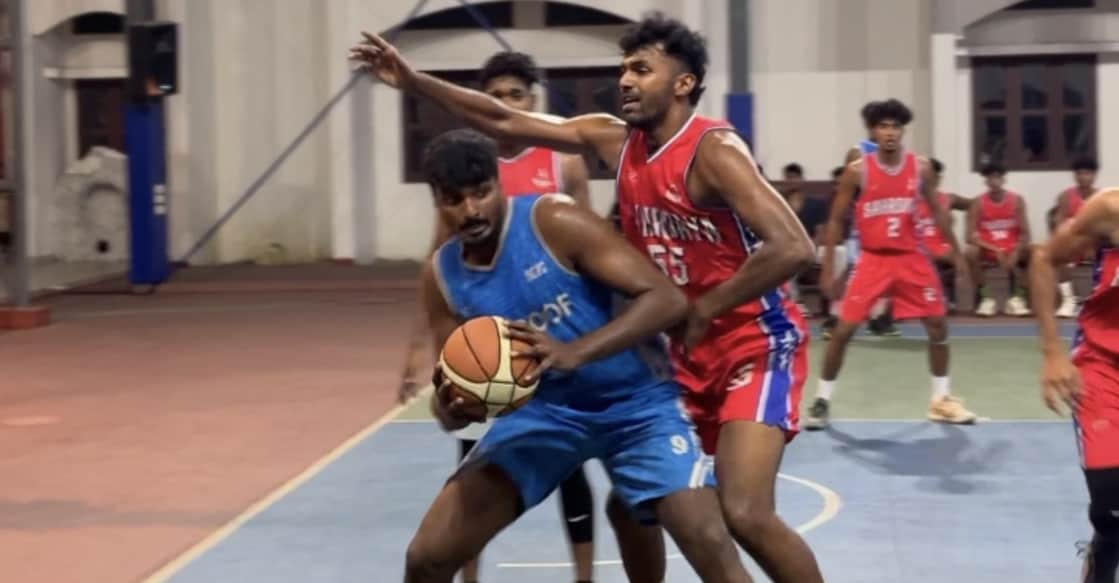 Action between Sree Kerala Varma College, Thrissur, (blue) and Sahrdaya College, Kodakara, in the semifinal of the Sacred Heart CMI Academy Inter-Club Basketball Tournament on March 22, 2026. Photo: Special arrangement