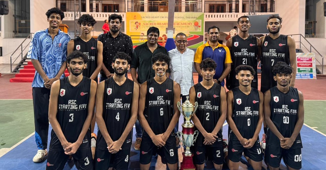 Players of the RSC Starting Five St Albert’s pose with staff and officials after winning the Tenson Vincent Memorial Trophy basketball tournament at Sacred Heart CMI Academy in Thevara on March 24, 2026. Photo: Special arrangement