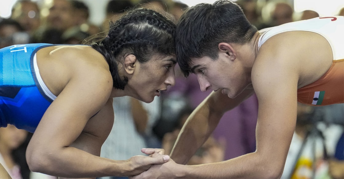 Vinesh Phogat, in blue, competes against Jyoti in a 53 kg category wrestling match during the Asian Games selection trials. Photo: PTI