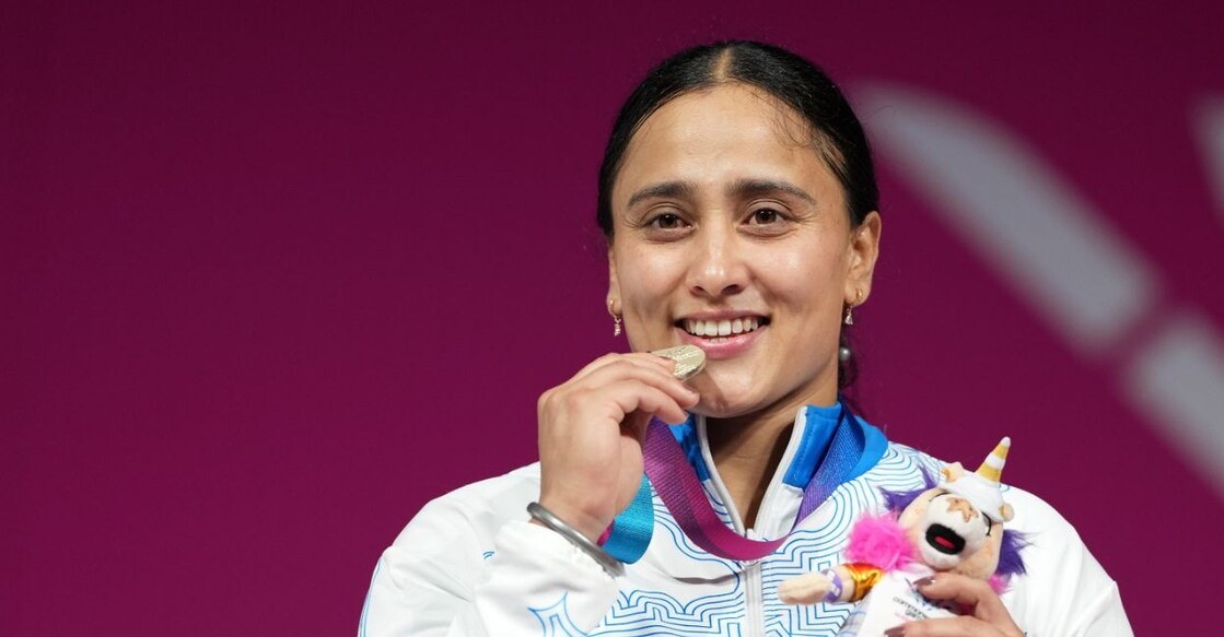 Silver medallist India's Harjinder Kaur poses for photographs during the presentation ceremony after the women's 69kg weightlifting event at the 23rd Commonwealth Games, in Glasgow, Scotland. Photo: PTI