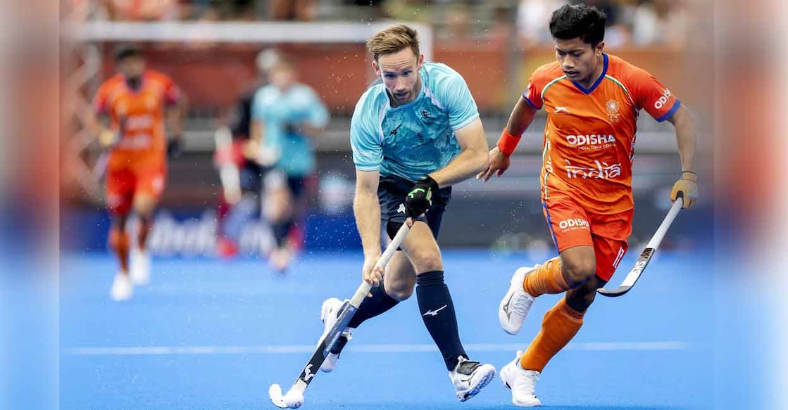 England's David Goodfield (L) and India's Nilakanta Sharma (R) fight for the ball during the 2026 FIH Men's Hockey World Cup on August 17, 2026. Photo: Koen van Weel / ANP / AFP