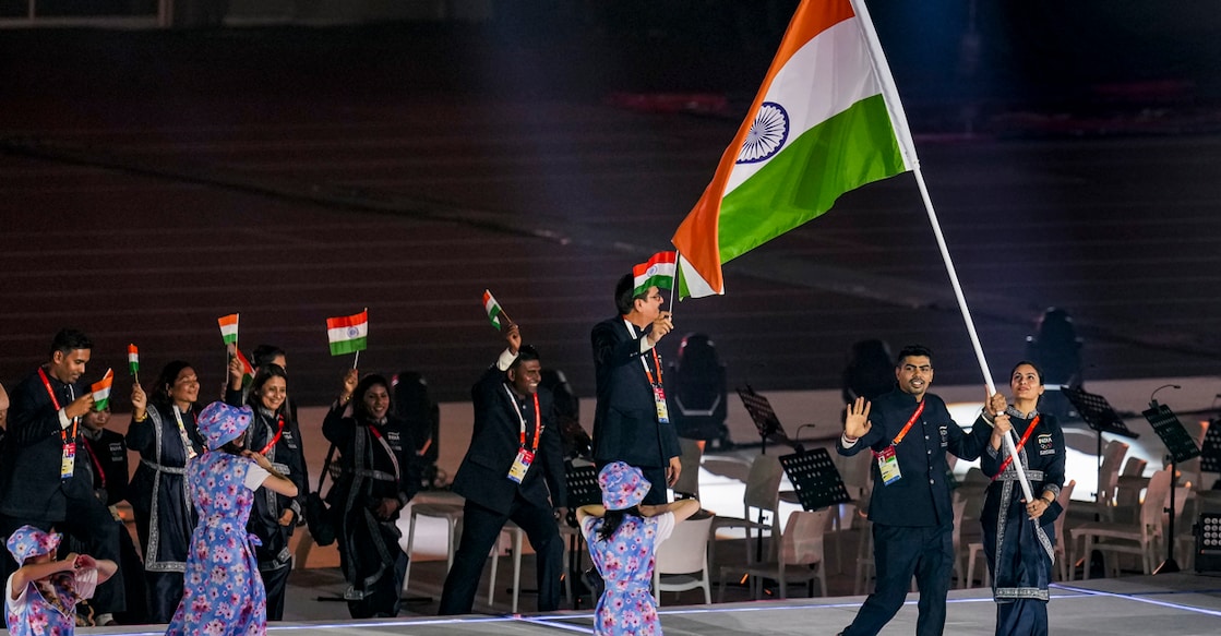 Nagoya: India's double Olympic medalist from Paris 2024 Manu Bhaker and kabaddi player Pawan Sehrawat lead the contingent at the athletes' parade, during the opening ceremony of the 20th Asian Games, in Nagoya, Japan, Saturday, Sept. 19, 2026. (PTI Photo/Arun Sharma)(PTI09_19_2026_000226B)