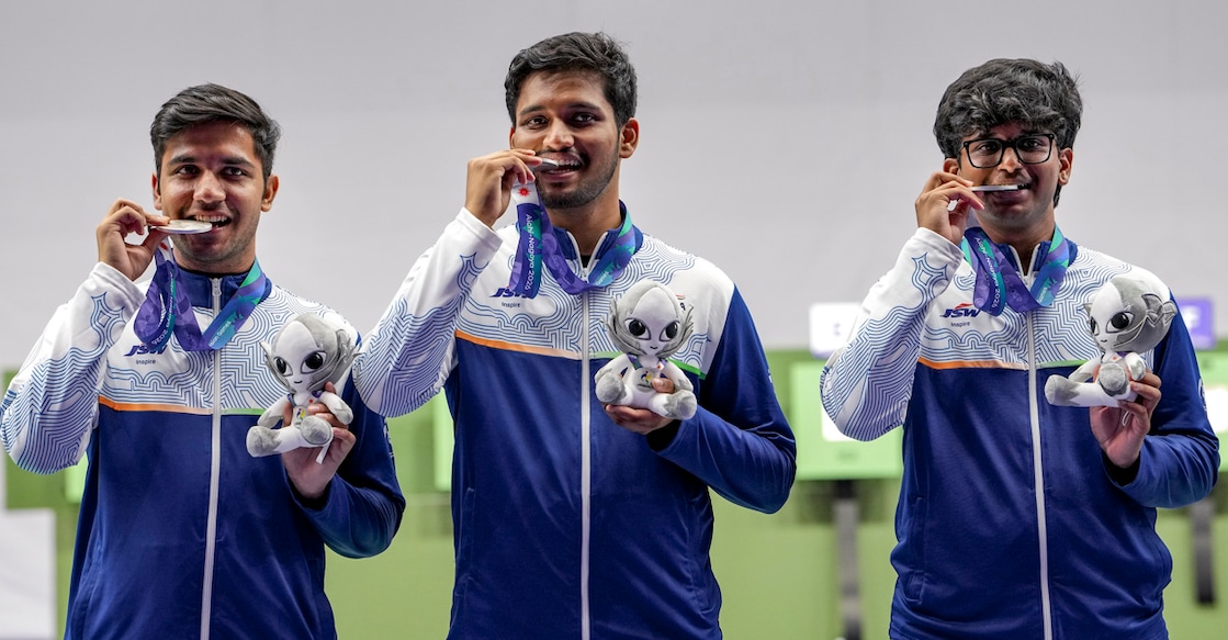 Nagoya: India’s Himanshu Dhillon, left, Rudrankksh Patil, Parth Rakesh Mane, right, and others pose for photographs after wiining silver medal in the 10 meter rifle men team event in the ongoing 20th Asian Games 2026, in Nagoya, Japan, Monday, Sept. 21, 2026. (PTI Photo/Atul Yadav)(PTI09_21_2026_000053A)