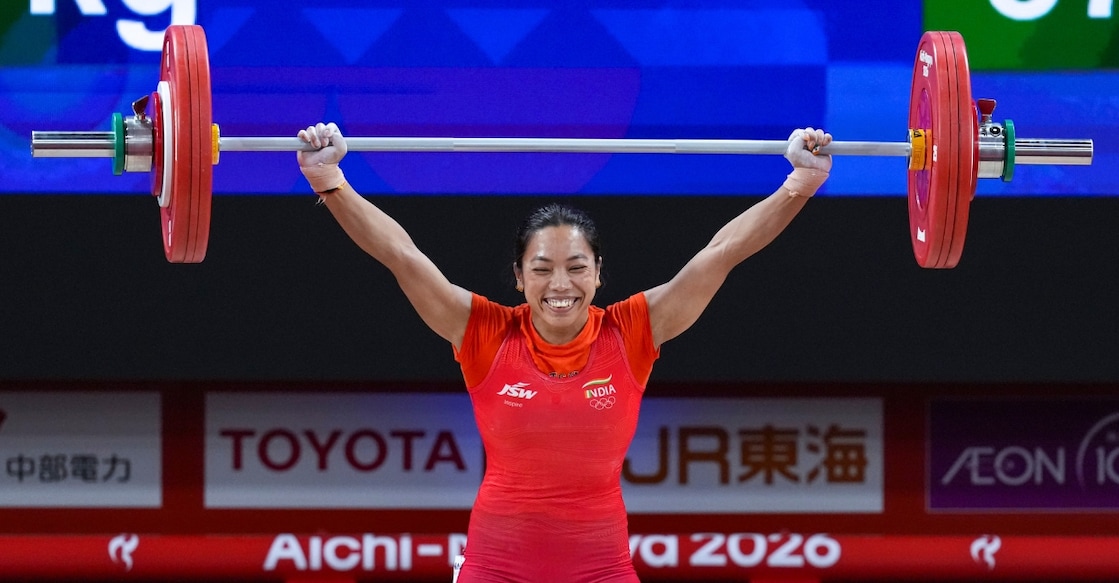 Mirabai Chanu competes in the Women's 49kg weightlifting final match during the 20th Asian Games. Photo: PTI