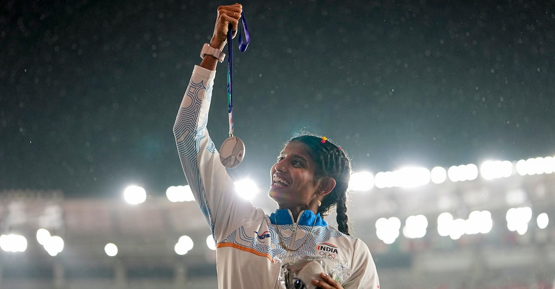 Nagoya: India's Ancy Sojan Edappilly poses on the podium after securing the silver medal in the women's long jump event during the ongoing Asian Games, in Nagoya, Japan, Monday, Sept. 28, 2026. (PTI Photo/Arun Sharma)(PTI09_28_2026_000267B)