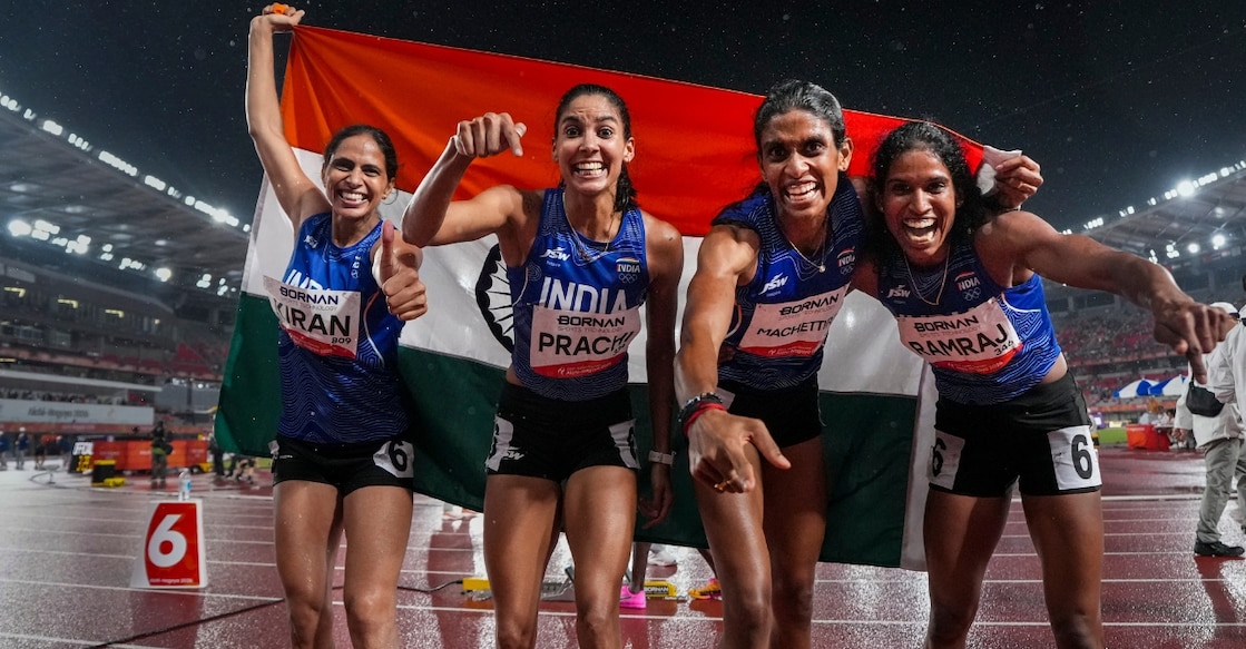 India's Kiran, Prachi, Poovama Machettira, and Vithya Ramraj celebrate after winning gold medal in the women's 4x400m relay. Photo: PTI