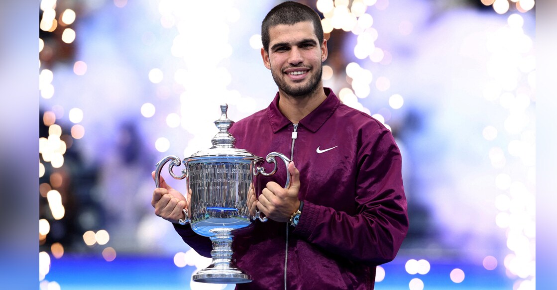 Spain's Carlos Alcaraz celebrates with the trophy after winning the men's singles final. Photo: REUTERS/Kevin Lamarque