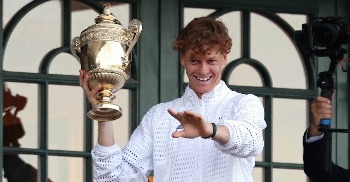Jannik Sinner holds the gentlemen's singles championship trophy on the South West Hall Balcony of Centre Court after winning Wimbledon at the All England Lawn Tennis and Croquet Club. Photo: Geoff Burke/ Imagn Images via Reuters