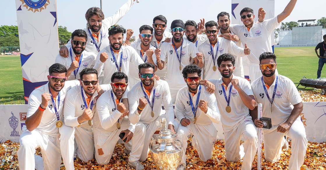 Jammu and Kashmir players pose with the trophy after the team's victory in the Ranji Trophy 2025-26 final cricket match against Karnataka at KSCA Stadium in Hubballi on February 28, 2026. Photo: PTI