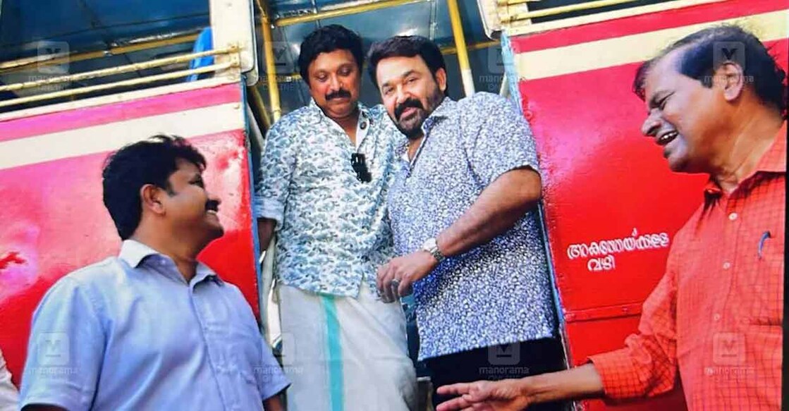 Mohanlal checks out new buses with Kerala Transport Minister KB Ganesh Kumar. Photo: Manorama
