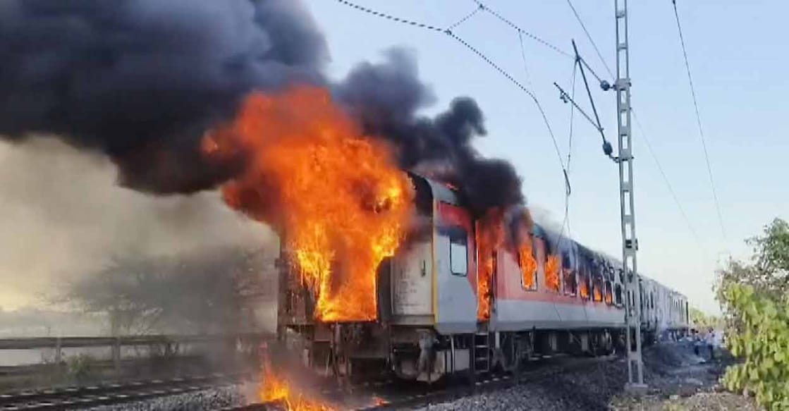 Flames and smoke billow after a fire broke out in an AC coach of the Thiruvananthapuram-Hazrat Nizamuddin Rajdhani Express in Madhya Pradesh's Ratlam district on Sunday. Photo: PTI