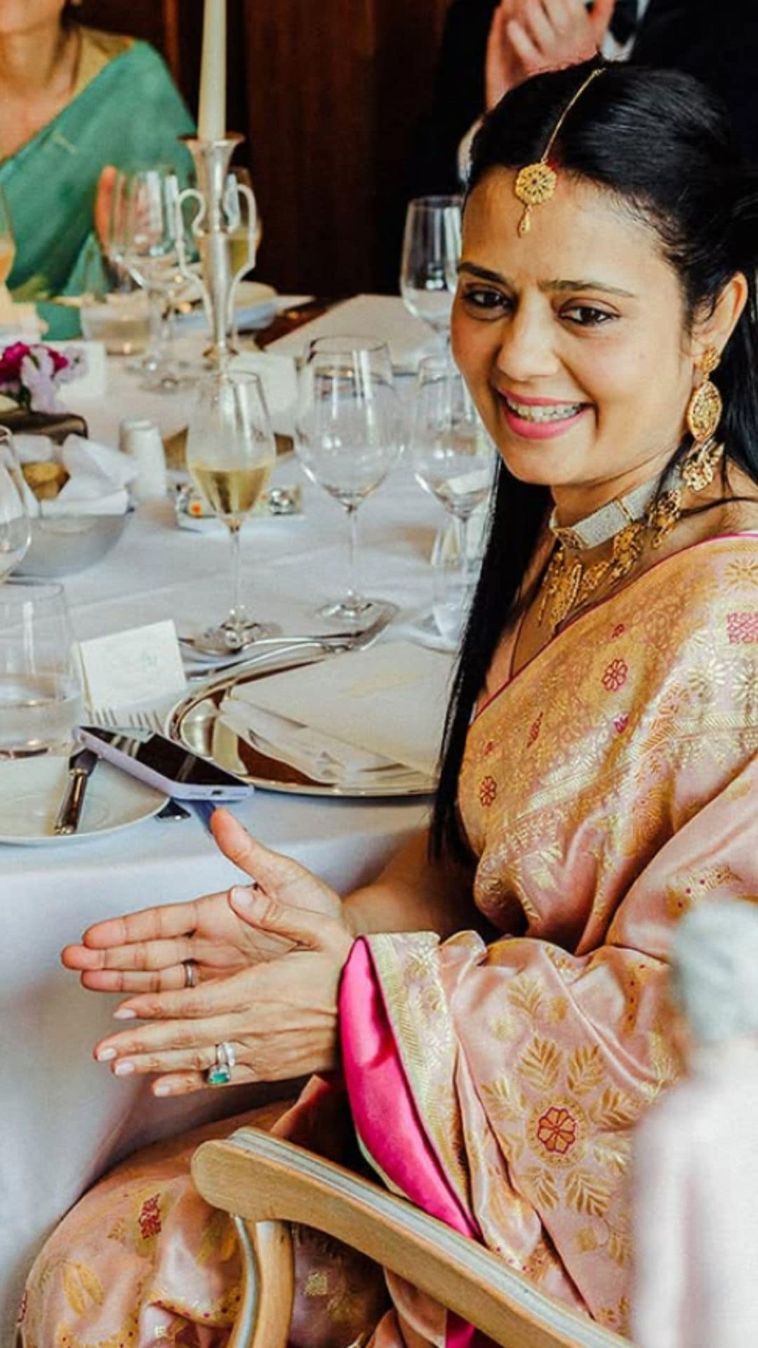 Floral motifs in rani pink meenakari adorned the sari’s trellis design. She paired it with a 'Gulshera' blouse in rich satin silk.