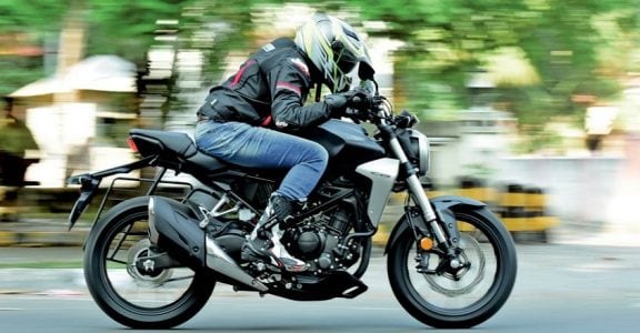 CB300R is Honda's international offering in the entry-level naked sports category. A sports bike much-awaited by enthusiasts in India. Why? There is only one answer, quality. You could blindly trust the build quality, says an admirer. Moreover, enthusiasts are expecting the same quality levels seen in international model here too. Is it true? Is it only about quality? What about performance? Well, here is our test ride report: Global star The CB300R was first launched in 2017. It then came as a replacement for the CB300F model, which was a naked bike with sporty looks. However, CB300R is a mix of sportiness and retro style. Superb finish When we first saw CB300R at EVM Honda Wing World Cochin, we understood why there is so much talk about the quality aspect - the build quality is pretty impressive. The paint quality and finishing too are top class. Honda is calling it the Neo-Sports Cafe. It sports the chiselled looks of a street sports bike. The body panels are sleek. The round headlamp ooze quality and design excellence. The blacked-out engine and alloys stand out. The fuel tank is long and muscular. Knee recesses are deep and can comfortably accommodate your knees. The silver scoop next to it adds to its looks. The CB300R shares its design elements with its bigger brother CB100R. Engine and other components are in black theme. There are some silver finishes at some places, which add to its premium feel. The LCD instrument console is fully digital that is clearly visible in bright daylight too. It shows gear shift indicators, average mileage and instant fuel efficiency etc. It features a flat handle bar that supports an aggressive riding position. The quality of switches is top notch. The position of horn switch could create some confusion initially. The bike is built around a diamond type trellis frame. It is designed in such a way that the rider’s weight is brought closer to the centre of the motorcycle. The CB300R weighs only 147 kg thus making it a pretty nimble handling bike. Compared to its rivals like KTM Duke 390, BMW 310R, it weighs considerably less. The wheelbase is also shorter than the rivals at 1344 mm. The split seat offers good cushioning. You sit 800 mm off the ground (Duke 390 - 830mm, G310 - 785 mm) which makes it easy for short riders. The tail section gets a sporty design. The dual chamber exhaust on the rear sports contrasting black with chrome underslung. Engine The CB300R is powered by a 286.01 cc liquid-cooled single-cylinder engine. It churns out 30.4 bhp of peak power and 27.4 Nm of peak torque. The engine comes mated to a six-speed manual transmission. The engine is very refined and delivers what is generally expected from a Honda. Throttle response is excellent. Though it has good low-end grunt, the mid-range is commendable. The power delivery is smooth. Ride comfort is another standout feature of the CB300R. Handling is sharp and you can filter through city traffic easily. Straight-line stability is good even at higher speeds. Even if you are riding for the first time, the CB300R offers you the same feel of a bike that you have been using for long. The bike gets fat 41 mm USD forks up front and a seven-step pre-load adjustable monoshock at the rear. It also gets a dual-channel ABS (anti-lock braking system) with an inertia measuring unit which distributes braking of the ABS. The motorcycle features disc brakes both up front and at the back with a radially-mounted, four-piston caliper taking care of braking duties up front and a single-piston caliper unit at the rear. The last word The CB300R boasts international build quality, classy looks and a sporty feel. The ride quality and performance too are superb. Vehicle provided by ECM Honda Wing World Cochin Ph. 9895661188 CB300R is Honda's international offering in the entry-level naked sports category. A sports bike much-awaited by enthusiasts in India. Why? There is only one answer, quality. You could blindly trust the build quality, says an admirer. Moreover, enthusiasts are expecting the same quality levels seen in international model here too. Is it true? Is it only about quality? What about performance? Well, here is our test ride report: Global star The CB300R was first launched in 2017. It then came as a replacement for the CB300F model, which was a naked bike with sporty looks. However, CB300R is a mix of sportiness and retro style. Superb finish When we first saw CB300R at EVM Honda Wing World Cochin, we understood why there is so much talk about the quality aspect - the build quality is pretty impressive. The paint quality and finishing too are top class. Honda is calling it the Neo-Sports Cafe. It sports the chiselled looks of a street sports bike. The body panels are sleek. The round headlamp ooze quality and design excellence. The blacked-out engine and alloys stand out. The fuel tank is long and muscular. Knee recesses are deep and can comfortably accommodate your knees. The silver scoop next to it adds to its looks. The CB300R shares its design elements with its bigger brother CB100R. Engine and other components are in black theme. There are some silver finishes at some places, which add to its premium feel. The LCD instrument console is fully digital that is clearly visible in bright daylight too. It shows gear shift indicators, average mileage and instant fuel efficiency etc. It features a flat handle bar that supports an aggressive riding position. The quality of switches is top notch. The position of horn switch could create some confusion initially. The bike is built around a diamond type trellis frame. It is designed in such a way that the rider’s weight is brought closer to the centre of the motorcycle. The CB300R weighs only 147 kg thus making it a pretty nimble handling bike. Compared to its rivals like KTM Duke 390, BMW 310R, it weighs considerably less. The wheelbase is also shorter than the rivals at 1344 mm. The split seat offers good cushioning. You sit 800 mm off the ground (Duke 390 - 830mm, G310 - 785 mm) which makes it easy for short riders. The tail section gets a sporty design. The dual chamber exhaust on the rear sports contrasting black with chrome underslung. Engine The CB300R is powered by a 286.01 cc liquid-cooled single-cylinder engine. It churns out 30.4 bhp of peak power and 27.4 Nm of peak torque. The engine comes mated to a six-speed manual transmission. The engine is very refined and delivers what is generally expected from a Honda. Throttle response is excellent. Though it has good low-end grunt, the mid-range is commendable. The power delivery is smooth. Ride comfort is another standout feature of the CB300R. Handling is sharp and you can filter through city traffic easily. Straight-line stability is good even at higher speeds. Even if you are riding for the first time, the CB300R offers you the same feel of a bike that you have been using for long. The bike gets fat 41 mm USD forks up front and a seven-step pre-load adjustable monoshock at the rear. It also gets a dual-channel ABS (anti-lock braking system) with an inertia measuring unit which distributes braking of the ABS. The motorcycle features disc brakes both up front and at the back with a radially-mounted, four-piston caliper taking care of braking duties up front and a single-piston caliper unit at the rear. The last word The CB300R boasts international build quality, classy looks and a sporty feel. The ride quality and performance too are superb. Vehicle provided by ECM Honda Wing World Cochin Ph. 9895661188