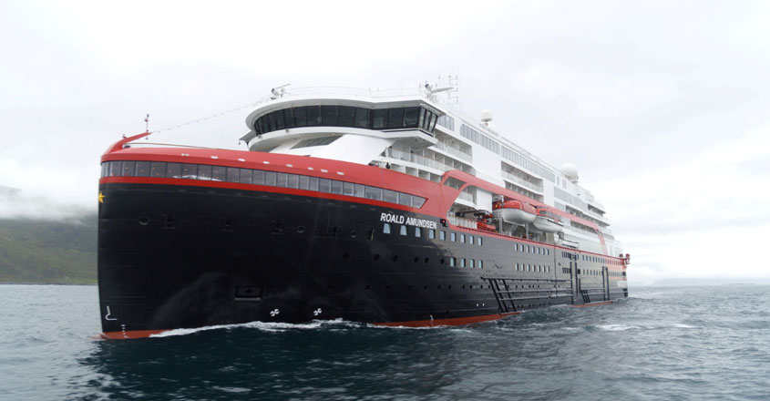 Roald Amundsen Hurtigruten's cruise ship MS Roald Amundsen is seen in the sea near Ulsteinvik, Norway July 1, 2019. Hurtigruten/Handout via Reuters