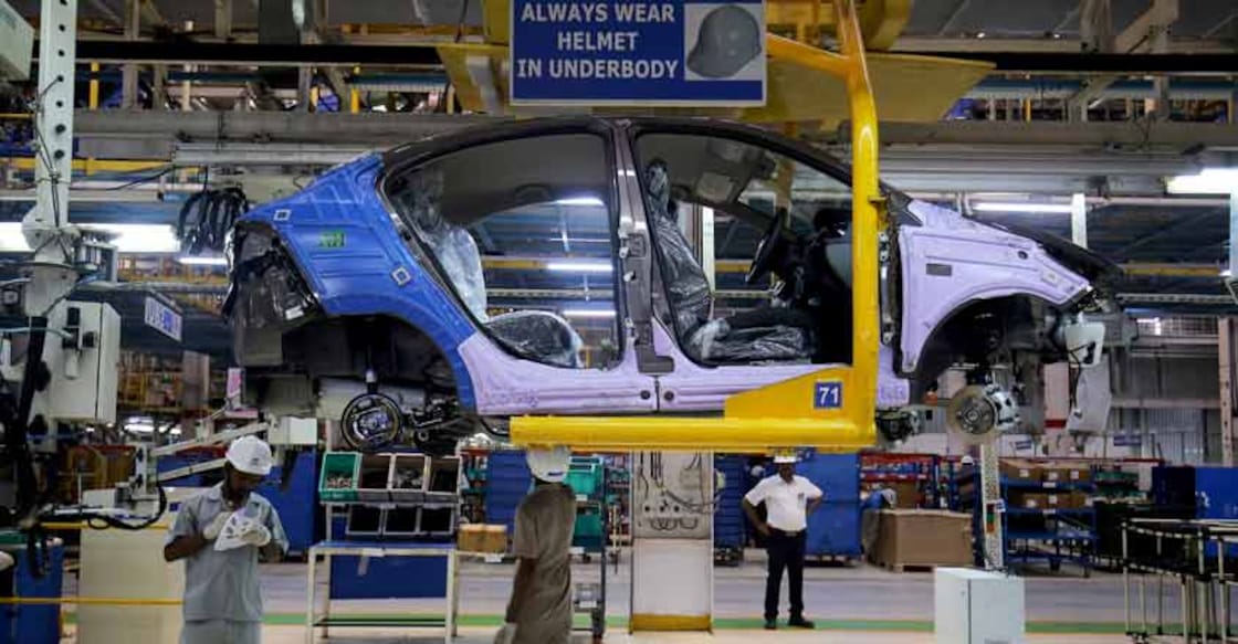 Workers assemble a Tata Tigor car inside the Tata Motors car plant in Sanand, on the outskirts of Ahmedabad. REUTERS/Amit Dave/File Photo