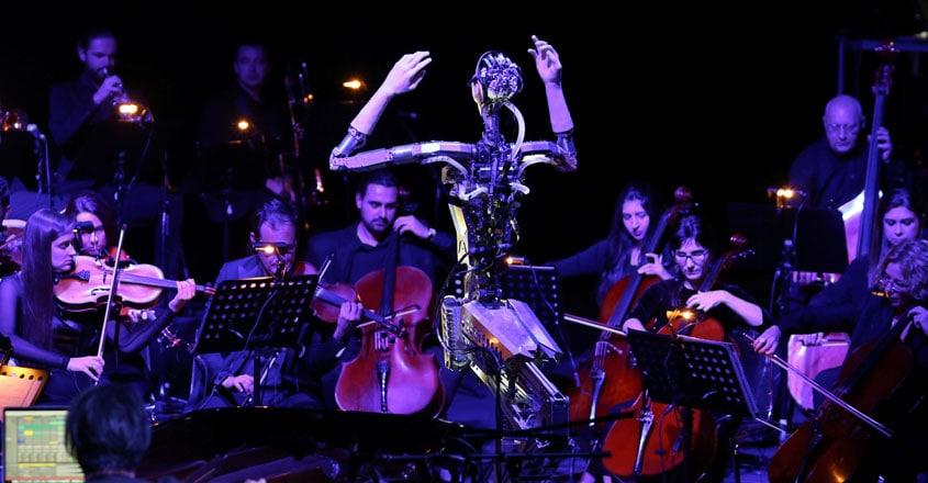 Music by numbers? Robot conducts human orchestra Music by numbers? Robot conducts human orchestra