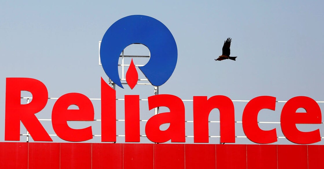 Reliance cuts pay of executives in oil-and-gas division