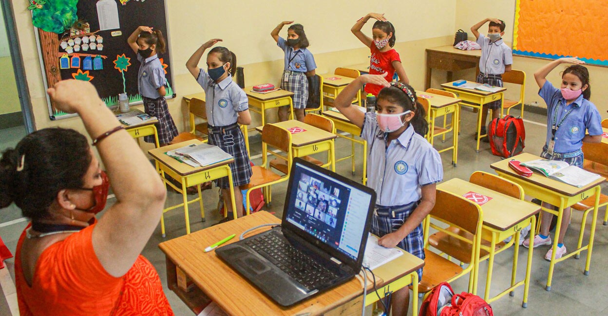 Students attend a class after authorities allowed schools to conduct classes for students of 1st to 5th standard as part of easing of COVID-19 induced restrictions, in Gurugram, Tuesday, Oct. 5, 2021. PTI