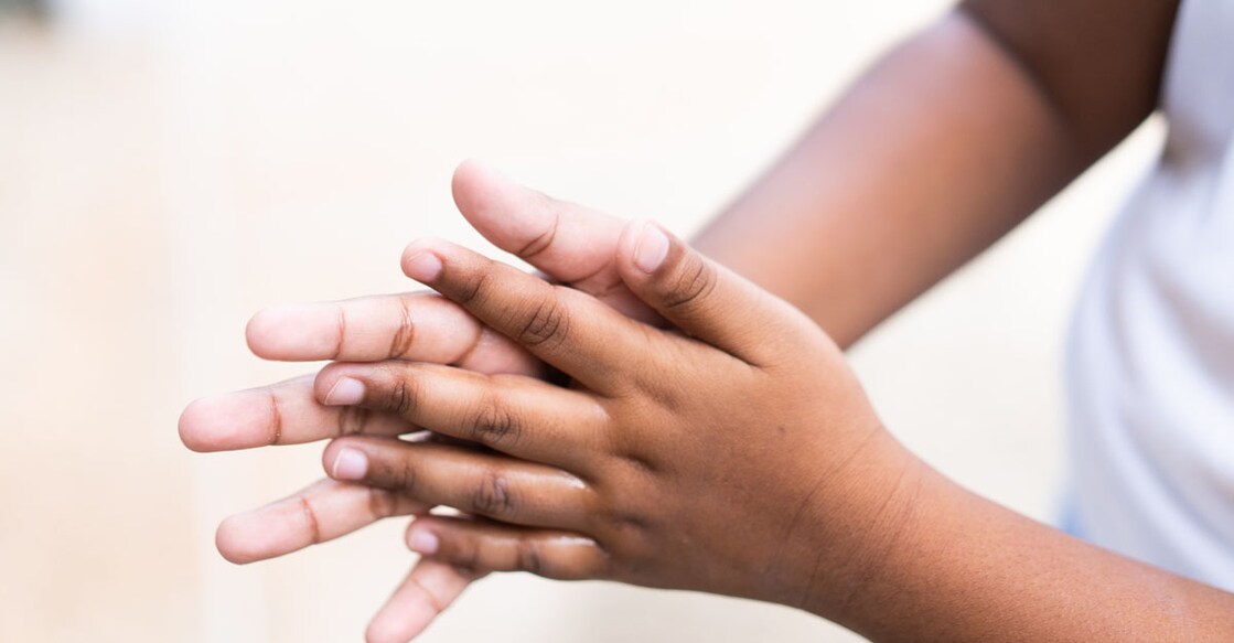 Child sanitising hands
