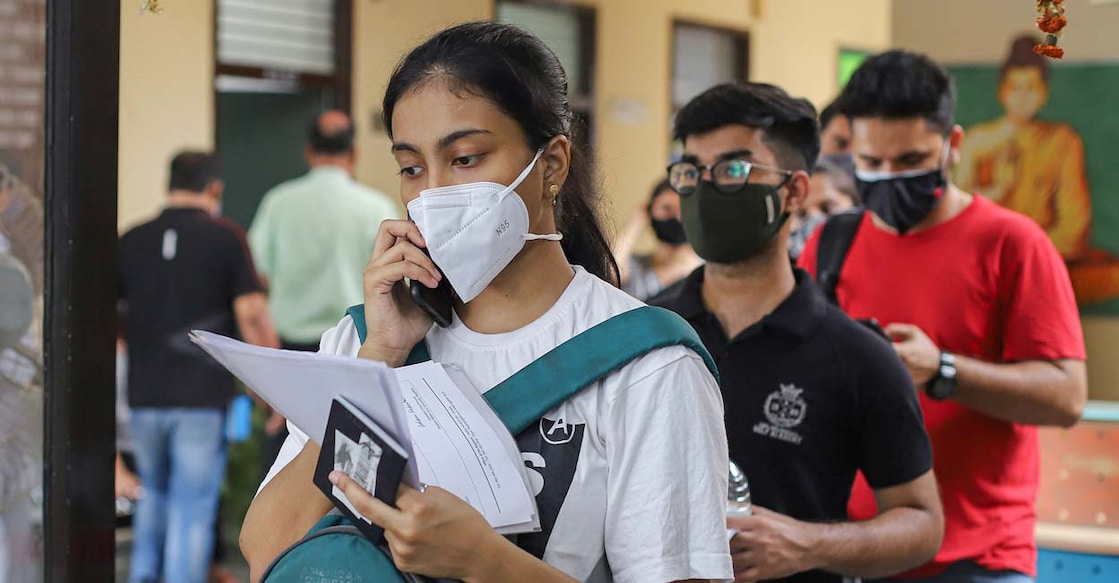 CBSE to declare Class 10 board results by July 20 Students and international travellers wait in a queue to complete paperwork before receiving COVID-19 vaccine dose, at a dedicated vaccination centre for international travellers, in New Delhi, Wednesday, June 16, 2021. PTI