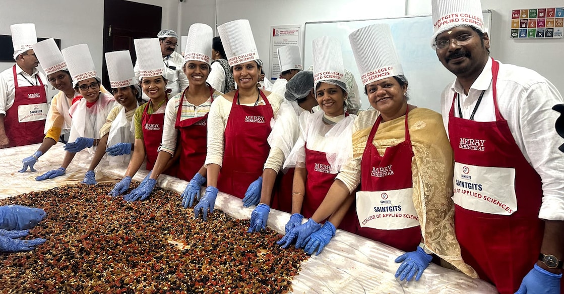 Teachers of Saintgits College during the cake-mixing event. Photo: Special arrangements