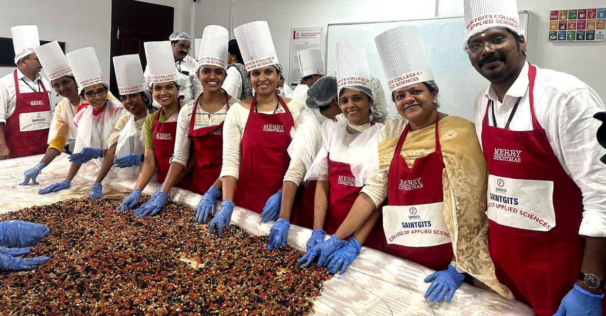 Teachers of Saintgits College during the cake-mixing event. Photo: Special arrangements