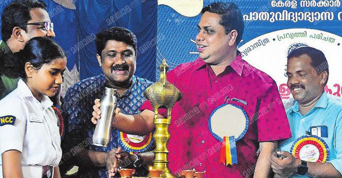 Kerala Speaker AN Shamseer lighting the innovative lamp by pouring water. Photo: Manorama