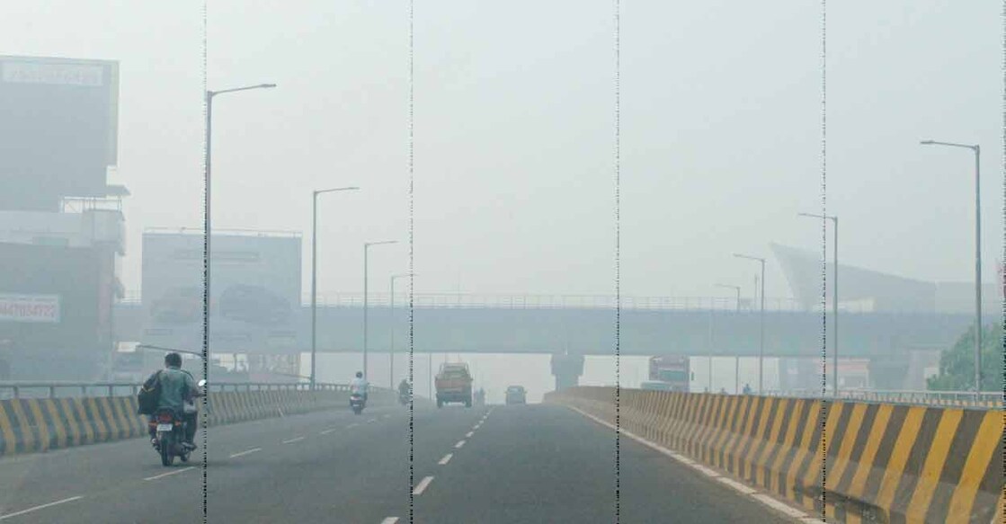 The Vyttila flyover seen through the smoke from the Brahmapuram waste dump yard. Photo: Manorama