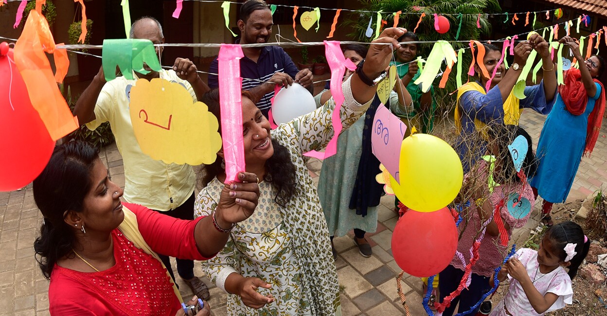 calicut-school Teachers decorating Kozhikode Govt Fisheries UP School as part of the first day of the new academic year. Photo: Manorama