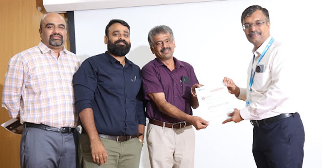 College Placement Officer Jenty Joy received the membership from ICT Academy CEO Santhosh Kurup. Photo: Special Arrangement 