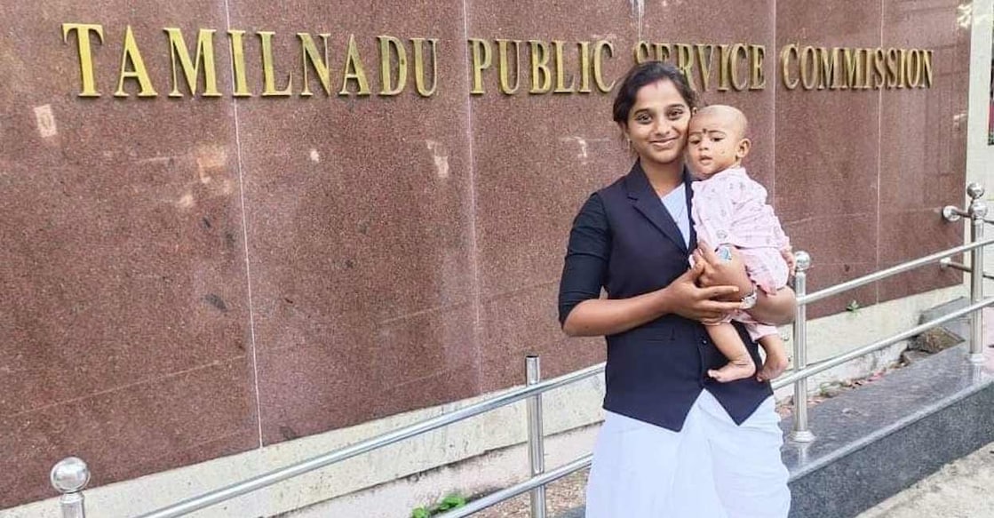 TN tribal woman writes PSC exam a day after giving birth, becomes judge Sripathi V with her baby in front of the Tamil Nadu Public Service Commission office in Chennai. This photograph was shared by Tamil Nadu CM M K Stalin via X.