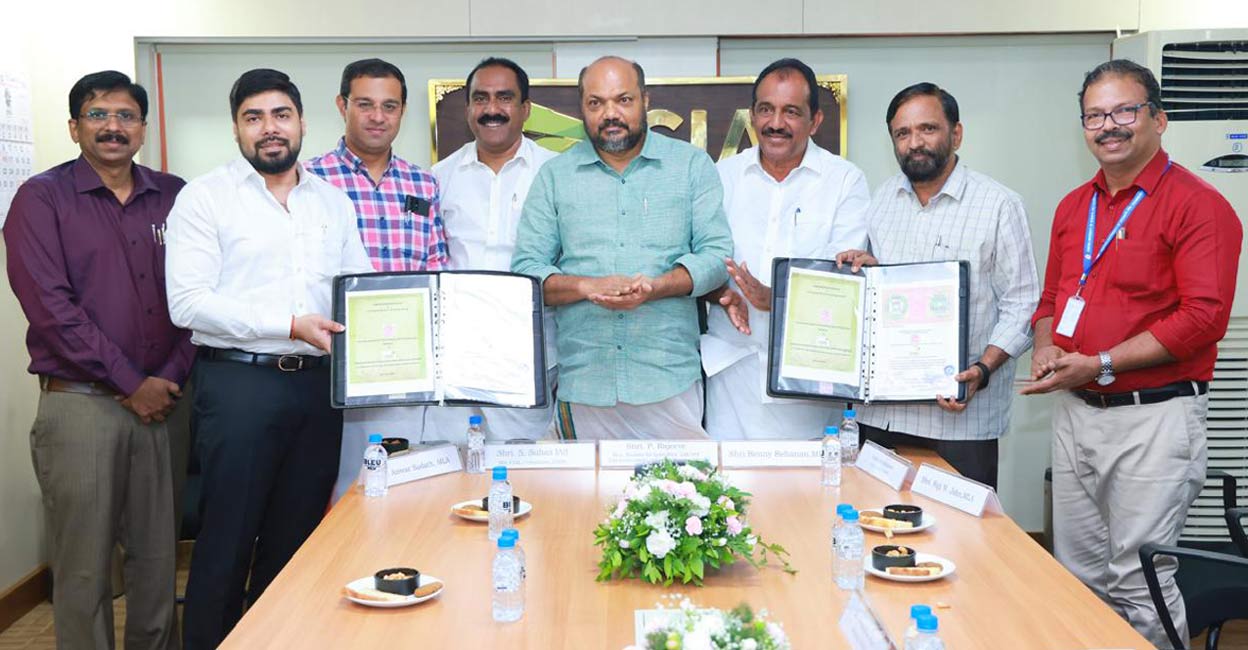 S Suhas IAS, MD CIAL and Prof P G Sankaran, Vice Chancellor, CUSAT exchange the MoU for making CIASL Academy an accredited institution of CUSAT in the presence of Minister P Rajeeve at a function held at Cochin Airport. Chalakudy MP Benny Behanan, MLAs Anwar Sadath, Roji M. John, CIASL MD Santhosh J Poovattil, CUSAT Registrar Dr V Sivanandan Achari are also seen. Photo: Special Arrangement