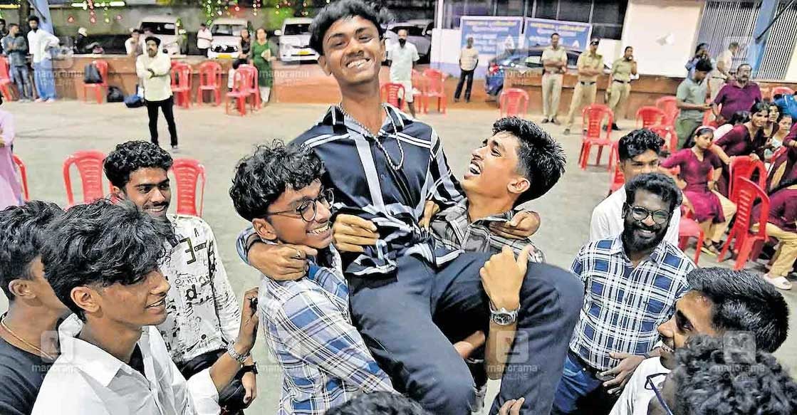 Harihardas is lifted by his friends in celebration of winning an A grade in the group instrumental music contest. Photo: Rinkuraj Mattancheriyil/Manorama