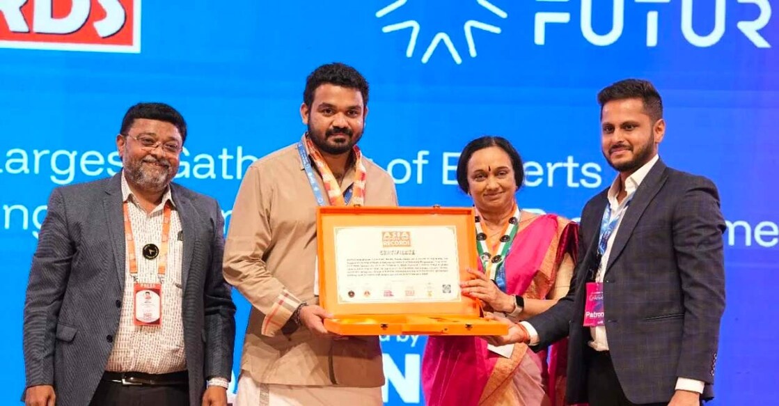 R Harish, jury member of the Asia Book of Records, presenting the official certificate for hosting the largest congregation of experts addressing the United Nations' sustainability goals to the Jain University.