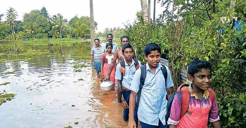 Flooded bund road worsens misery of water-short village