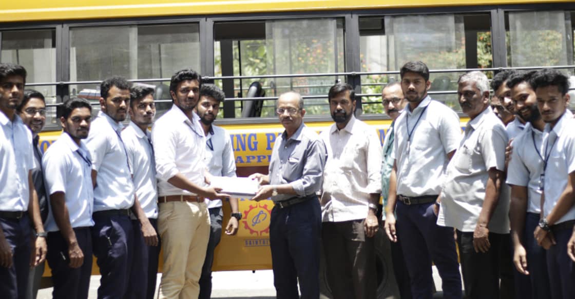 Saingits students hand over notebooks to flood-hit