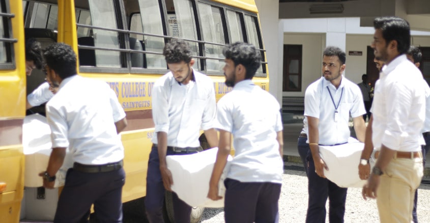 Saingits students hand over notebooks to flood-hit Saingits students hand over notebooks to flood-hit
