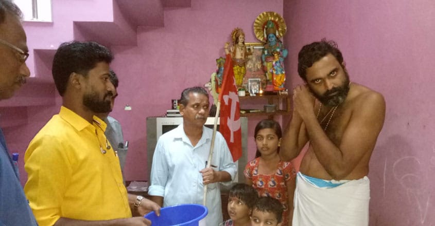 Temple priest offers earrings to flood victims Temple priest offers earrings to flood victims