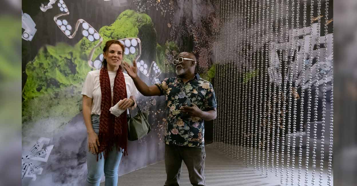 Professor Estefania Guevara enjoys an installation at Kochi Muziris Biennale along with Bose Krishnamachari, the chief organiser of the event. Photo: Special arrangement