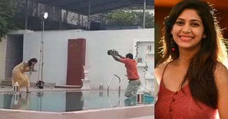 This cameraman actually jumps into pool with camera